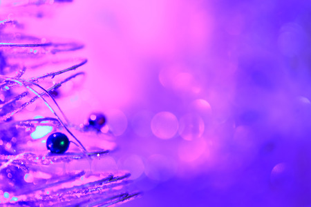 Christmas background of bokeh lights with close up christmas treeの写真素材