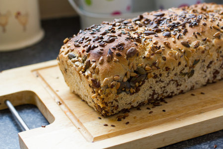 Organic home made bread freshly baked with lots of seeds close up