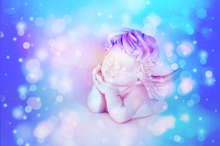 Figurines of angel on white backgroundの写真素材