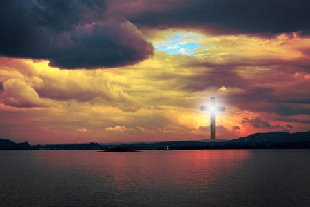The Cross of Jesus Christ and beautiful cloudsの写真素材