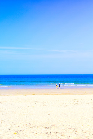 English beach on summer with young familyの写真素材