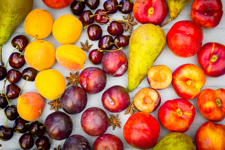 Stone Autumn fruit on the wooden table, flat view.の写真素材