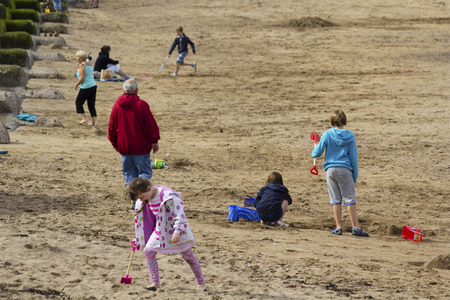 Tourists having fun in Eyemouth in Scotland, UK. 07.08.2015のeditorial素材