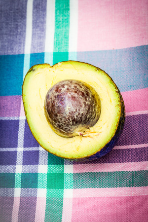 Avocado background with fresh organic avocado on old wooden table, top viewの写真素材