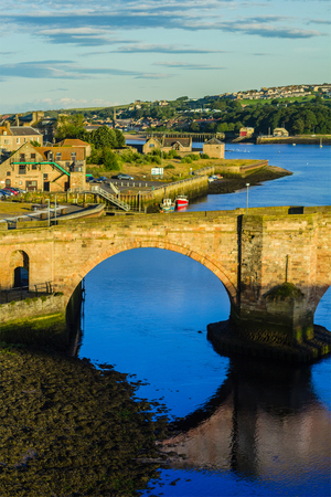 Berwick Bridge, also known as the Old Bridge, spans the River Tweed in Berwick-upon-Tweed, Northumberland, Englandのeditorial素材