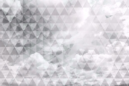 Abstract, trendy, geometric design with triangles and clouds in shades of gray.の写真素材