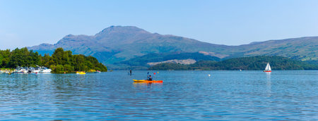 Luss at Loch Lomond, Scotland, 25 August 2019. People relaxing and having fun during one of the hot...