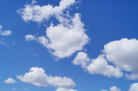 blue sky with white clouds background outdoorsの写真素材