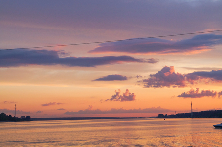 Colorful sunset rurple and pink over the riverの写真素材