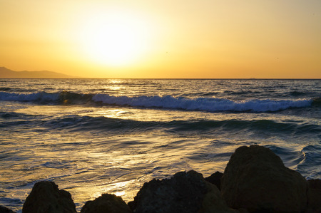 Sea wave close up, low angle view, sunrsie shotの写真素材