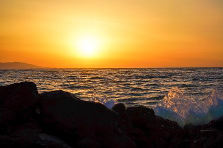 Sea wave close up, low angle view, sunrsie shotの写真素材