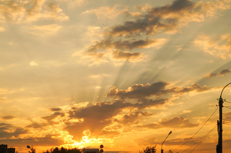 Beautiful Fiery orange sunset sky background with cloudsの写真素材
