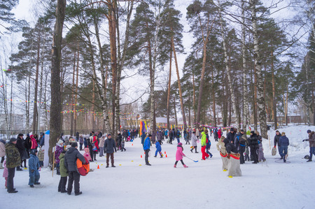 Kostroma, Russia February 16, 2017: Kids celebrate Maslenitsa Pancake week - purely Russian Holiday. People eat pancakes, play folk games, have fun letting long winter out, Moscow, February 16, 2016.のeditorial素材