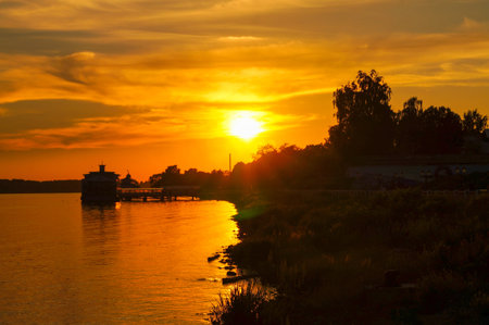 beautiful yellow and orange sunset on the riverの写真素材