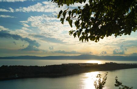 A beautiful Croatian coastal sunset overlooking the Adriatic Sea. Sunset horizon sea water landscape.の写真素材