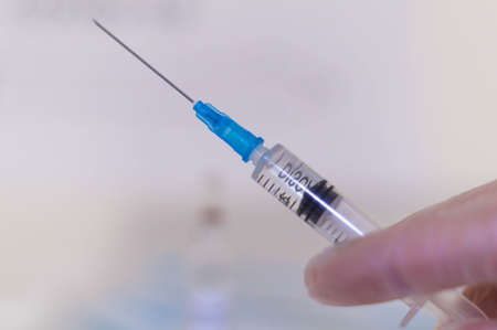Human Hand with injection Syringe, on white background vaccination coronavirusの写真素材