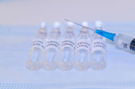 coronavirus vaccine. sars-cov-2 COVID-19. Some ampoules with ncov-2019 vaccine in a box. to fight the coronavirus pandemic.の写真素材