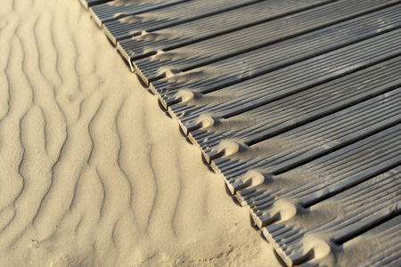 sand dunes and wooden walkways on the beachの写真素材