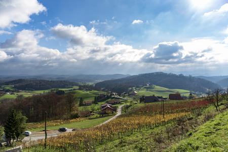 Asvaltnaf road in the countryside of Slovenia, Hogas slatina, cumulus cloudsの写真素材