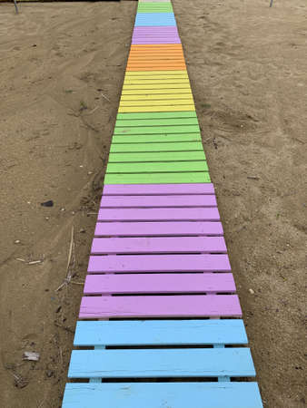Colorful wooden pathway on the beach photoの写真素材