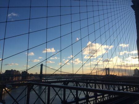 Amazing view at the New York City Brooklyn Bridge in Manhattan with skyscrapers and city skyline over Hudson Riverの写真素材
