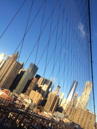 Amazing view at the New York City Brooklyn Bridge in Manhattan with skyscrapers and city skyline over Hudson Riverの写真素材
