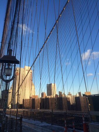 Amazing view at the New York City Brooklyn Bridge in Manhattan with skyscrapers and city skyline over Hudson Riverの写真素材
