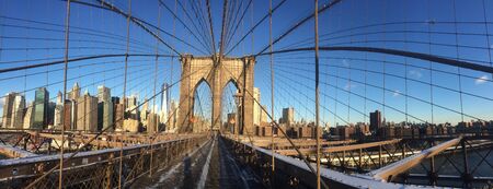 A view of the Brooklyn Bridge in New York City.の写真素材