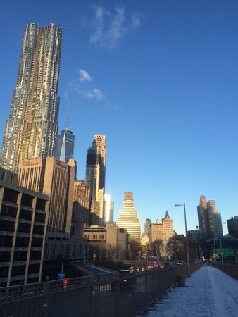 Amazing view at the New York City Brooklyn Bridge in Manhattan with skyscrapers and city skyline over Hudson Riverの写真素材