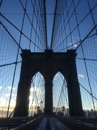 A view of the Brooklyn Bridge in New York City.の写真素材