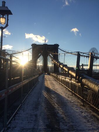 A view of the Brooklyn Bridge in New York City.の写真素材