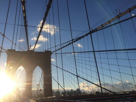 A view of the Brooklyn Bridge in New York City.の写真素材