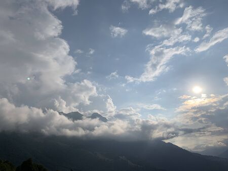 Smoky mountain landscape with mountain and light rays before sunset.の写真素材