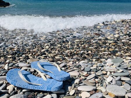 Sleepers on a pebble beach in a summer outing. copy spaceの写真素材
