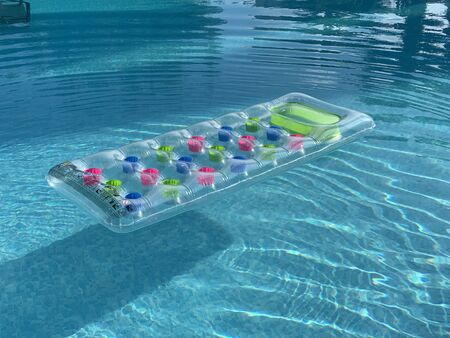 one inflatable mattress floating on water surfaceの写真素材