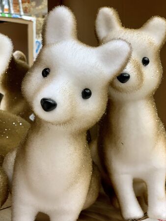 A lot of toys arctic fox standing in the shop, cute Christmas toysの写真素材