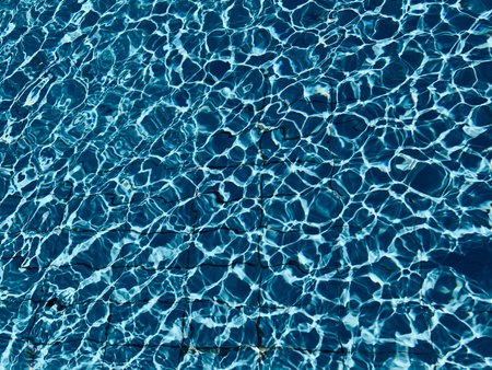 beautiful clear pool water reflecting in the sun