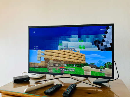 05.04.2020 Cyprus Paphos Tv set computer with minecraft computer game on screen in the home during quarantine in self isolationのeditorial素材