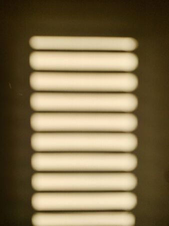 shadow on the white curtain through the blindsの写真素材