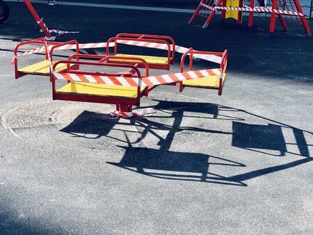 Closed children's playground. Ban on children 's playgrounds. Prevention of coronavirus COVID-19. The fight against the virus. No children on the Playground in the yard.の写真素材