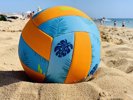 colorful beach ball on nature coast landscapeの写真素材