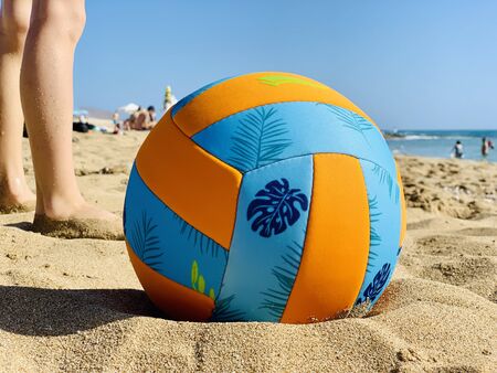 colorful beach ball on nature coast landscapeの写真素材