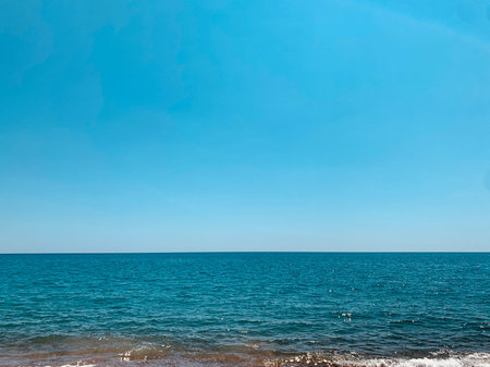 Beautiful Mediterranean landscape. View of empty wild beach and clear turquoise water of...