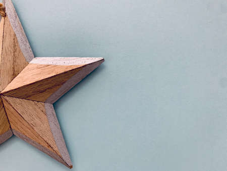 Christmas festive wooden star decoration on white. Christmas background.の写真素材