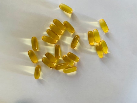Cod liver oil omega 3 gel capsules isolated on white backgroundの写真素材
