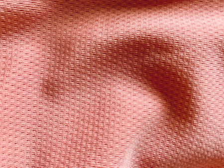 Light pale pink satin fabric texture surface background textileの写真素材