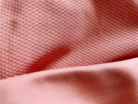 Light pale pink satin fabric texture surface background textileの写真素材