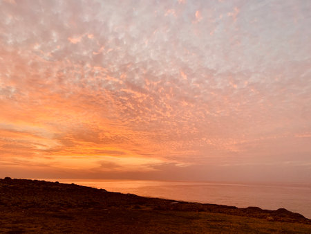Pink orange Sunset over the sea Burning Down Cyprusの写真素材