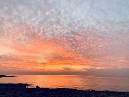 Pink orange Sunset over the sea Burning Down Cyprusの写真素材