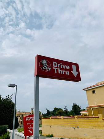 Cyprus Paphos January 17, 2020 KFC drive through sign on KFC Kentucky Fried Chicken restaurant